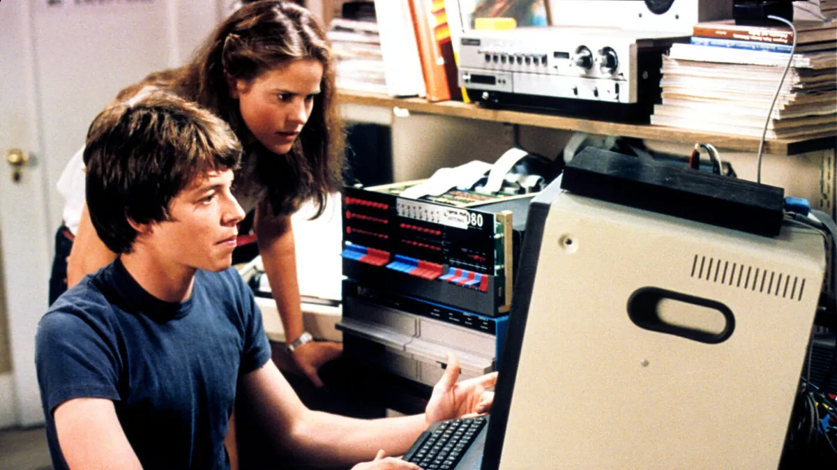 Matthew Broderick and Ally Sheedy in WarGames, staring at the IMSAI 8080 terminal in his bedroom