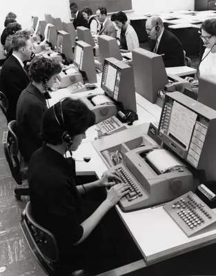 An airline reservation agent typing at an IBM SABRE terminal